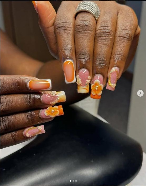 Burnt orange gel-x set with sculpted 3D flowers and pearl detailing